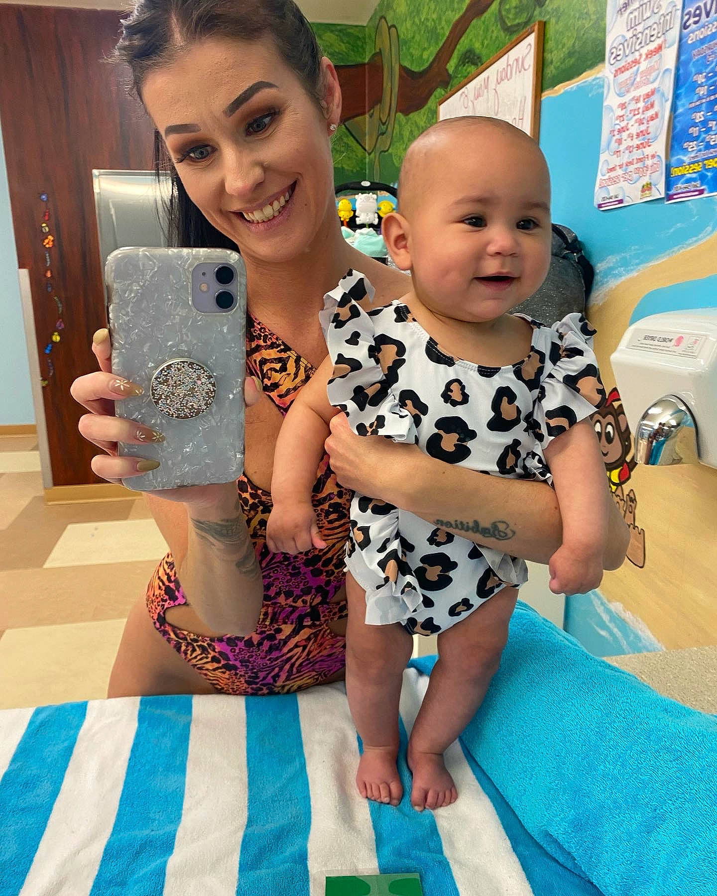 Nola is registered to the contest to win money with this photo: arm, baby, baby_toddler_clothing, child, event, eye, face, fashion, finger, fun, green, hairstyle, happy, head, joy, leisure, mobile_phone, person, skin, smile