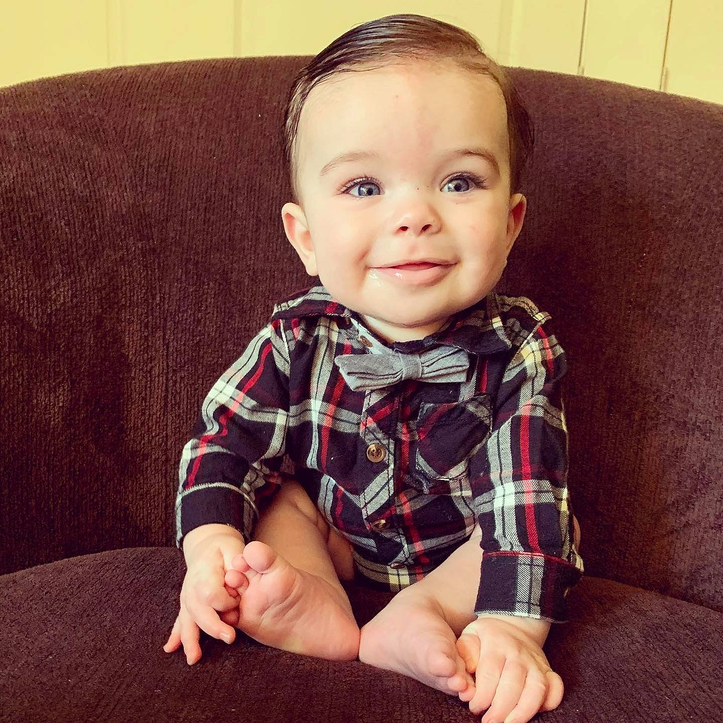 Asher Sineath is registered to the contest to win money with this photo: arm, baby, beauty, cheek, child, chin, cool, design, eye, face, facial_expression, head, joy, lip, nose, pattern, person, plaid, sitting, skin