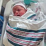 James joined the competition — help win amazing prizes! newborn, baby, blanket, hospital, bassinet, sleeping, infant, swaddled, hat, face, bed, medical, footprint_pattern, plastic, nursery, quiet, peaceful, child, person, healthcare