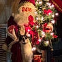 cat, santa_claus, christmas_tree, holiday_lights, decorations, festive, indoor, black_and_white_cat, ornaments, christmas_decor, teddy_bear, miniature_sleigh, gifts, holiday_scene, celebration, christmas, night, warm_lighting, festive_spirit, holiday_cheer