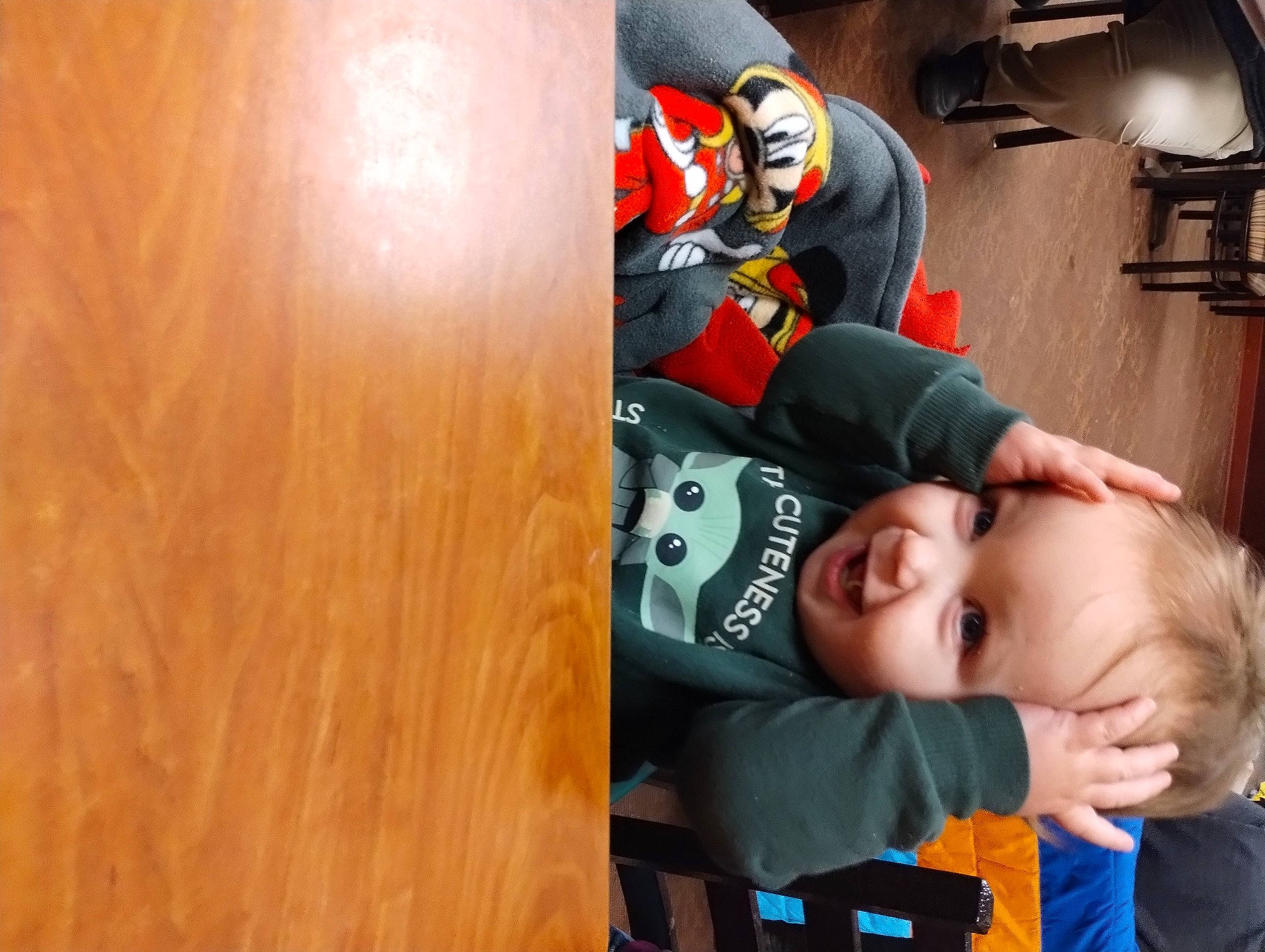Colson is registered to the contest to win money with this photo: baby, baby_products, baby_toddler_clothing, child, comfort, flooring, fun, hardwood, headgear, helmet, orange, person, personal_protective_equipment, recreation, sitting, smile, sports_gear, sportswear, t_shirt, toddler
