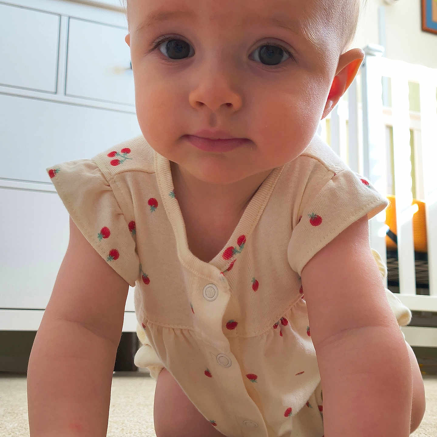 Imogene is registered to the contest to win money with this photo: baby, babycrawling, bodypart, cabinet, crawling, crib, drawer, face, finger, furniture, hand, head, indoors, infantbed, nursery, person, photography, portrait, room, sitting