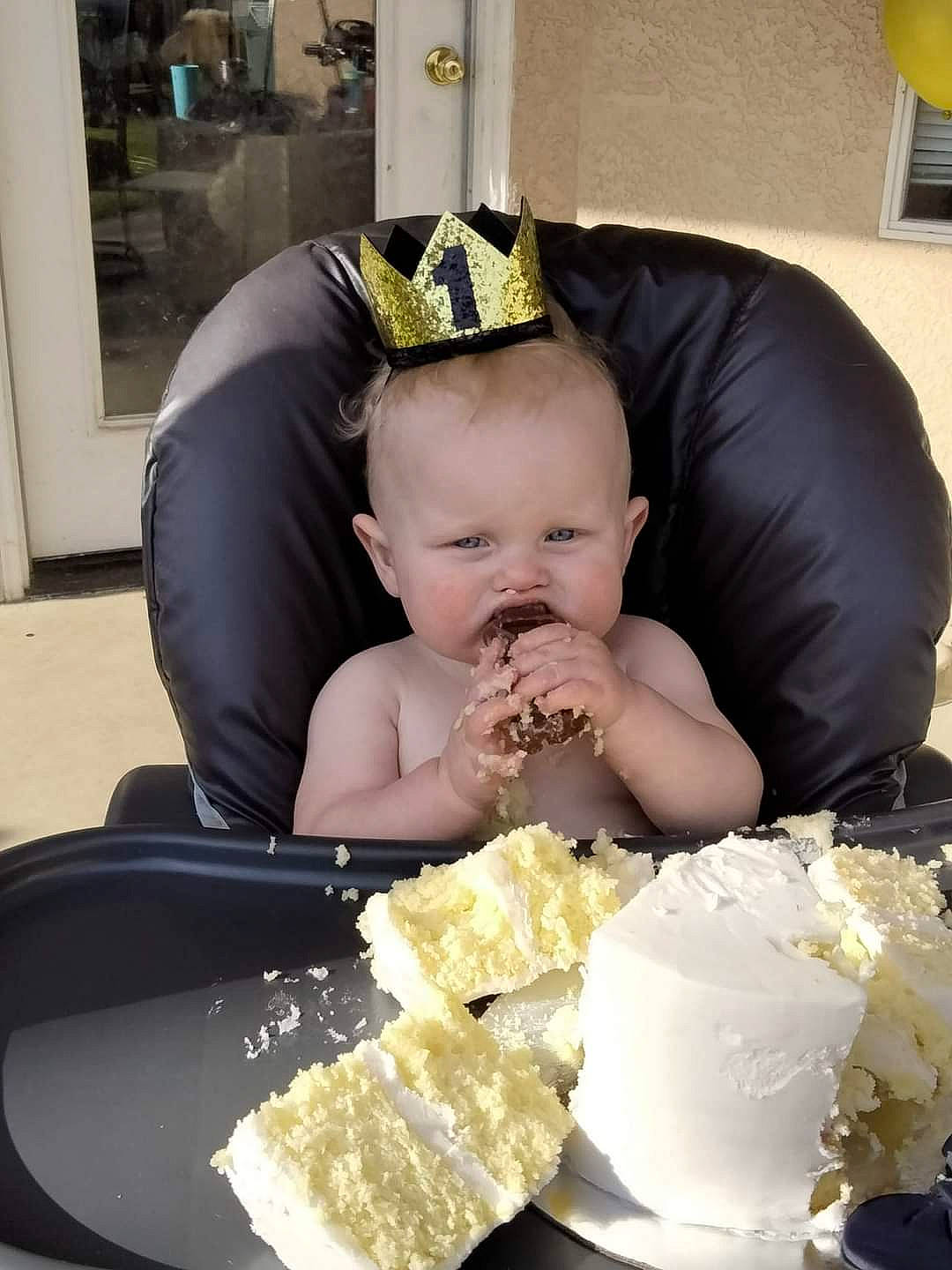 Kai is registered to the contest to win money with this photo: baby, cap, chair, child, comfort_food, cuisine, dish, event, fashion_accessory, food, ingredient, person, picture_frame, plate, recipe, sitting, sugar_cake, sweetness, tableware, toddler