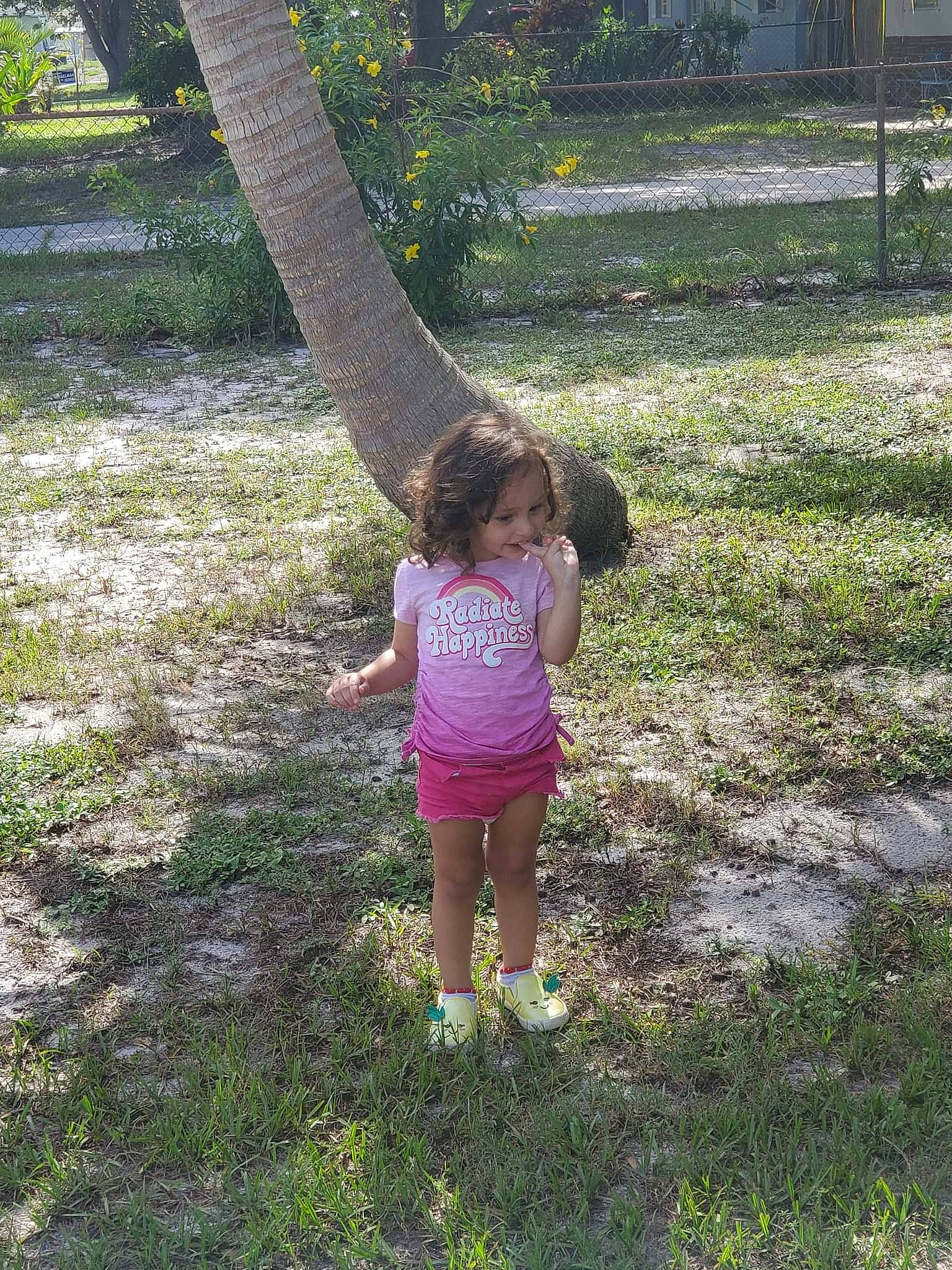 Rosalie is registered to the contest to win money with this photo: botany, branch, gesture, grass, groundcover, happy, leaf, leg, leisure, people_in_nature, person, plant, shorts, summer, terrestrial_plant, tints_and_shades, tree, trunk, waist, woody_plant