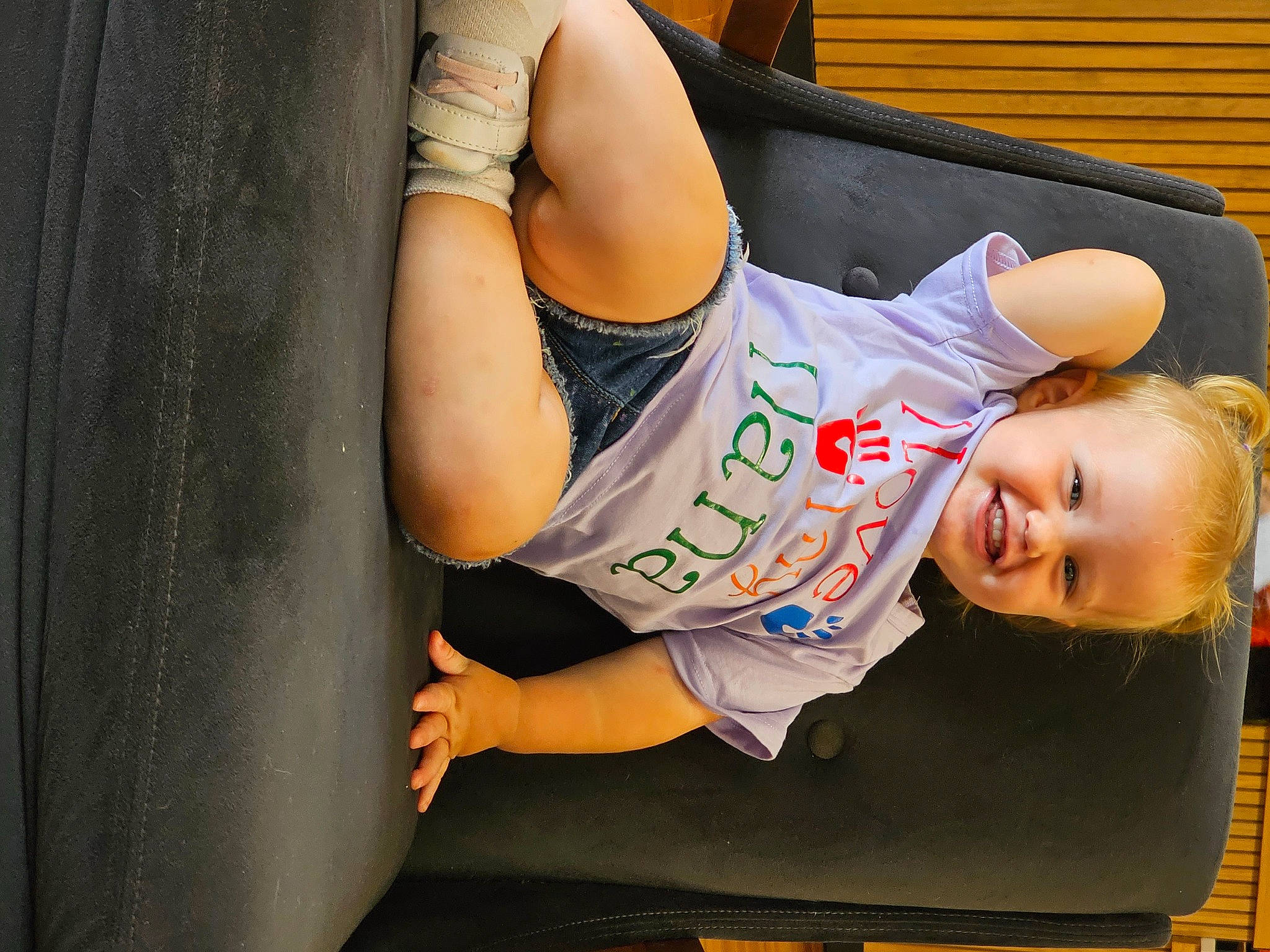 Cadence is registered to the contest to win money with this photo: child, comfort, elbow, eyewear, finger, fun, gesture, happy, human_leg, joint, joy, knee, leg, leisure, person, shoulder, sitting, sportswear, t_shirt, thigh