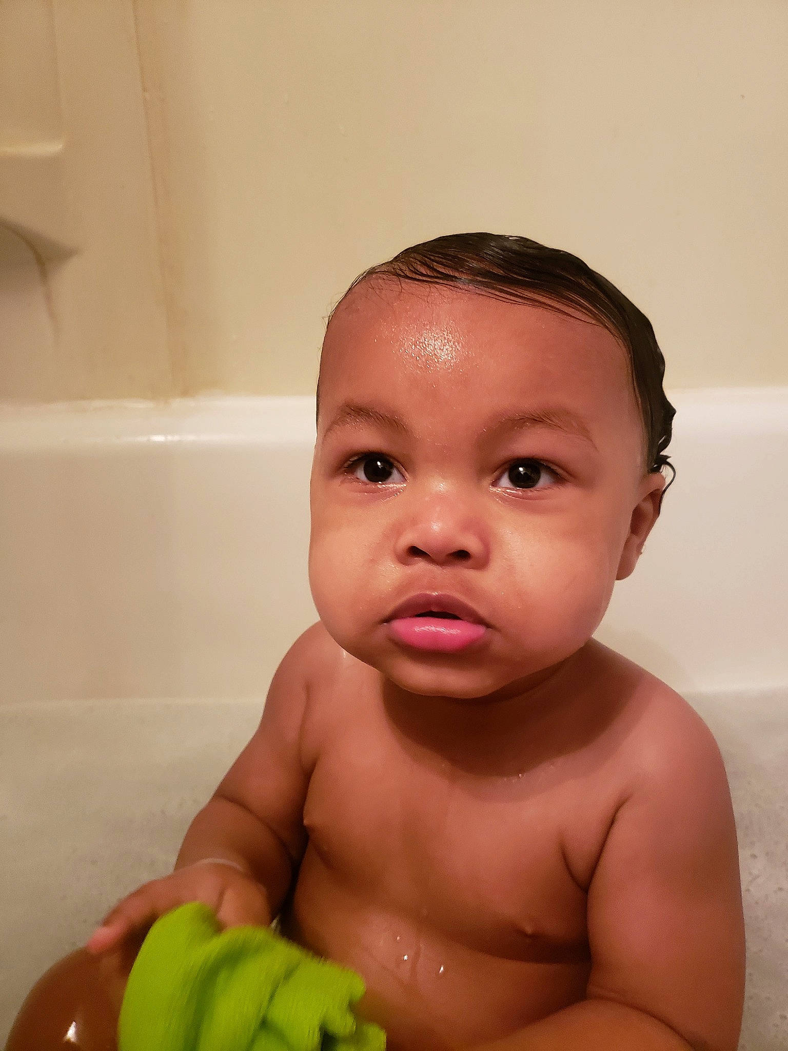 Kenny is registered to the contest to win money with this photo: baby, baby_bathing, bathing, bathtub, cheek, child, chin, eye, face, forehead, head, mouth, muscle, nose, person, skin, stomach, toddler, washing