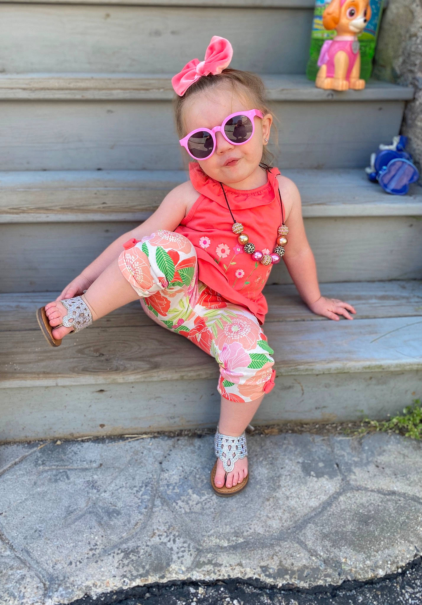 Kenzleigh is registered to the contest to win money with this photo: child, clothing, cool, design, dress, eyewear, fashion_accessory, glasses, pattern, peach, person, pink, plant, sleeve, sunglasses, toddler