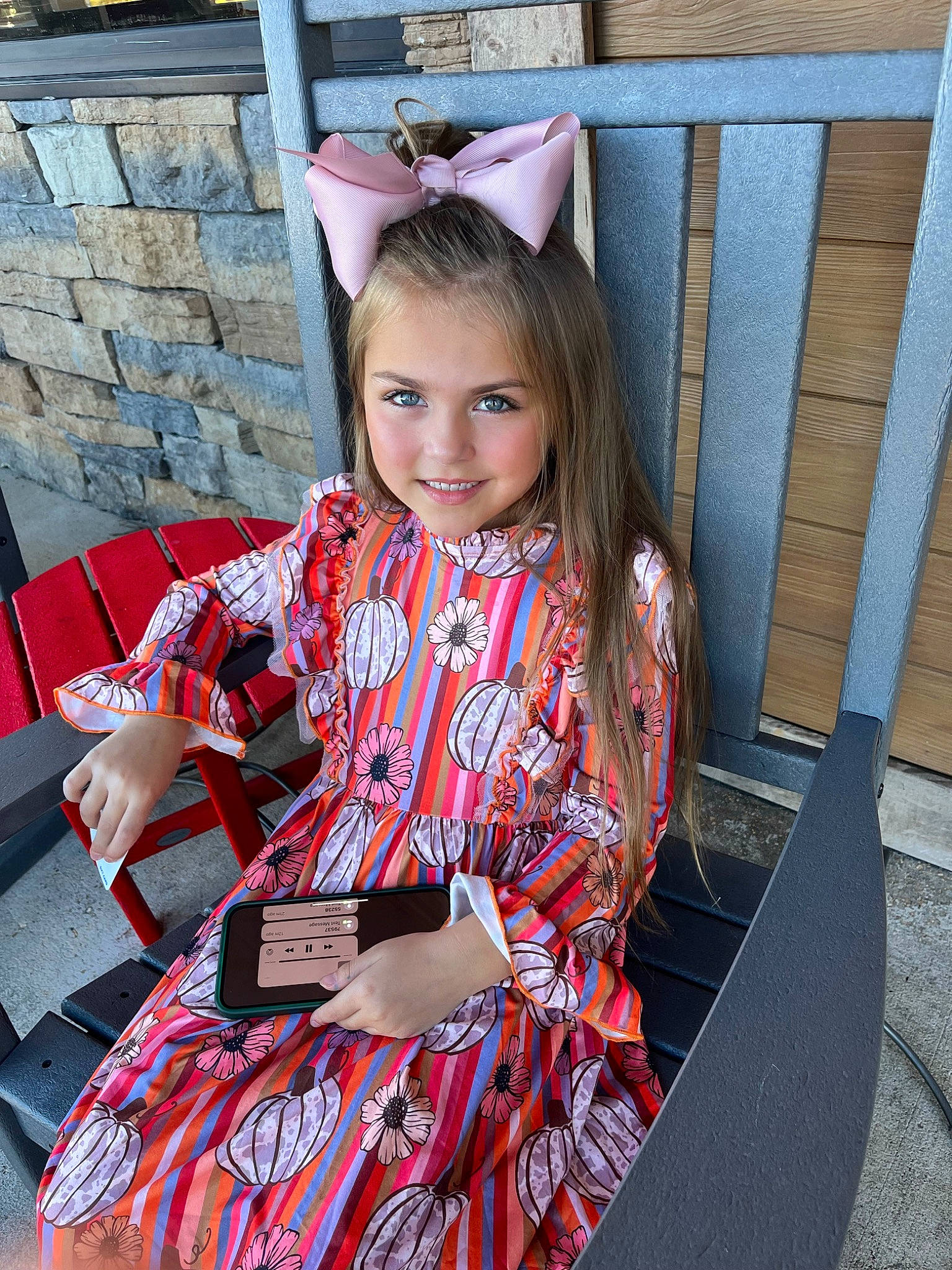 London is registered to the contest to win money with this photo: brown_hair, dress, electric_blue, event, eyewear, fashion_accessory, fashion_design, formal_wear, fun, happy, joy, leisure, long_hair, pattern, person, pink, plaid, sleeve, smile, tartan