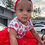 Esteisy is registered to the contest to win money with this photo: baby, child, tutu, red_headband, red_skirt, outdoor, cloudy_sky, house, car, sitting, cute, portrait, face, hand, foot, clothing, smiling, infant, person, daylight