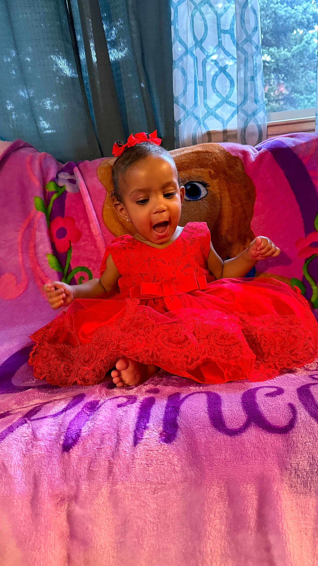 Esteisy joined the competition — help win amazing prizes! toddler, child, red_dress, bow, sitting, blanket, princess_theme, happy, indoors, curtains, window, smiling, feet, face, young_child, portrait, colorful, fabric, home, excited