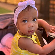 Esteisy joined the competition — help win amazing prizes! toddler, child, baby, headband, bow, yellow_clothing, striped, stroller, outdoor, portrait, curious, face, eyes, skin, arm, person, summer, cute, infant, babywearing