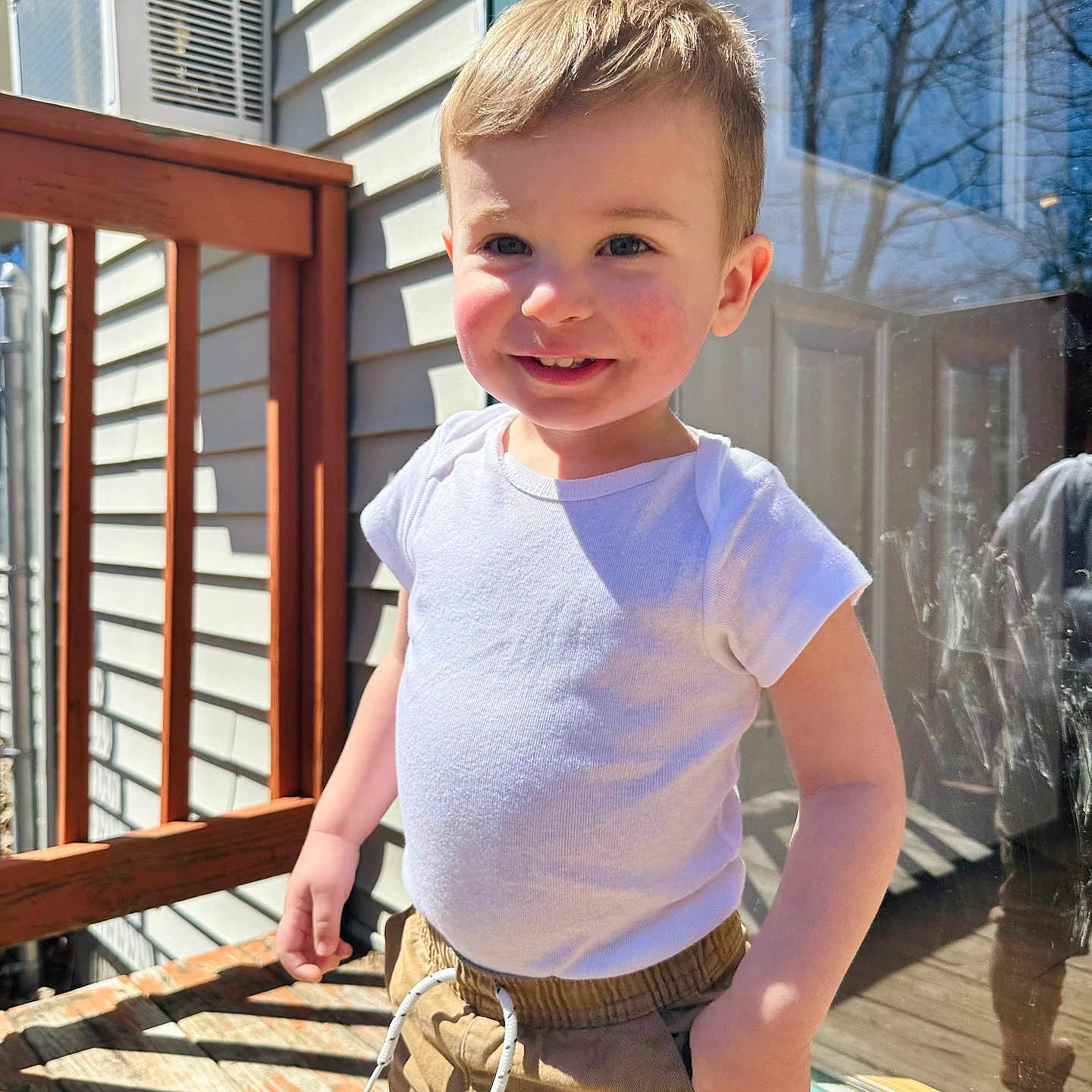 Timber is registered to the contest to win money with this photo: architecture, boy, building, child, clothing, face, head, house, housing, male, pants, person, photography, plant, porch, portrait, pottedplant, shorts, t_shirt, wood