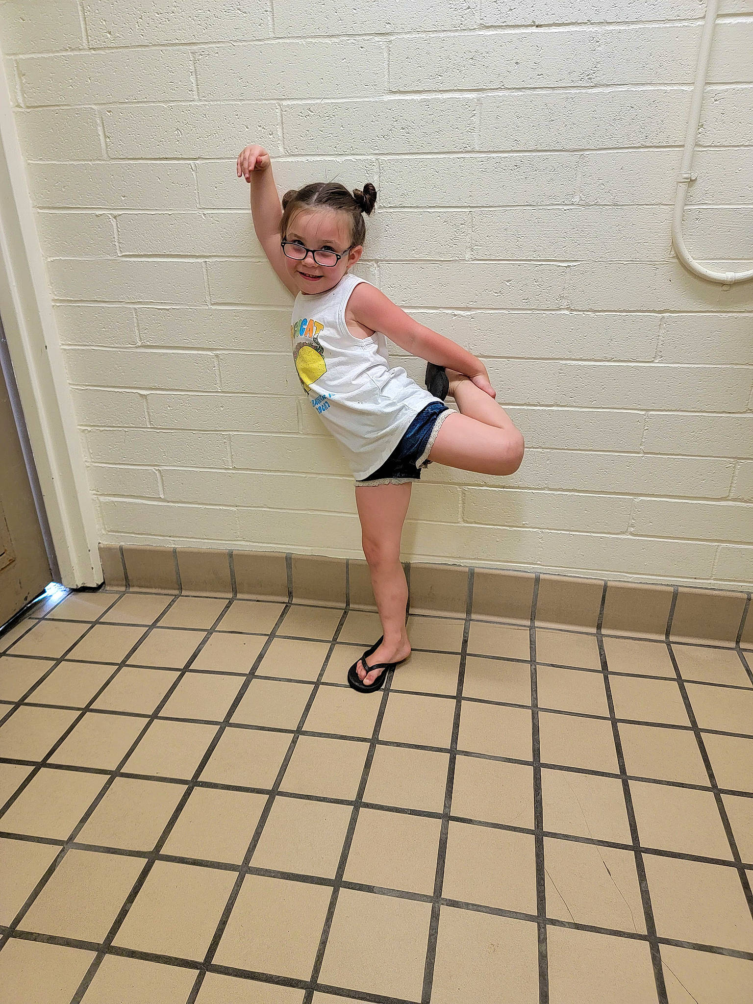 Haylee is registered to the contest to win money with this photo: baby_toddler_clothing, balance, barefoot, composite_material, design, elbow, floor, flooring, fun, happy, human_leg, joint, joy, knee, leg, leisure, person, sandal, standing, thigh