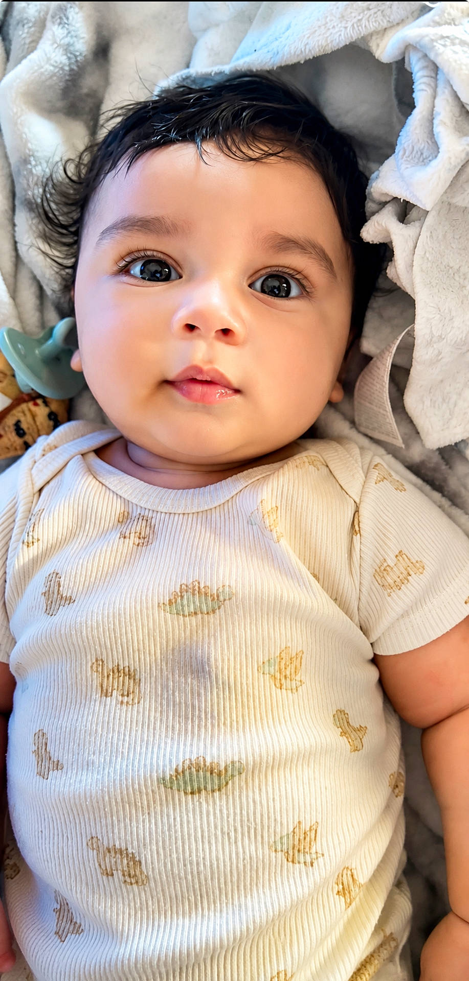 adorable, baby, baby_boy, baby_girl, blanket, child, clothing, cute, expression, eyes, face, hair, indoors, infant, lying_down, onesie, peaceful, portrait, skin, soft_texture