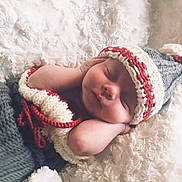 Zackary is registered to the contest to win money with this photo: baby, baby_sleeping, beanie, bonnet, cap, child, crochet, ear, fun, fur, headgear, knit_cap, knitting, nap, photography, skin, sleep, smile, toddler, wool