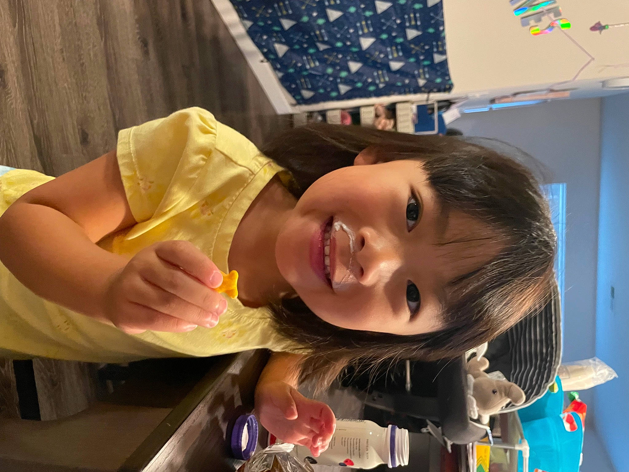 Mia is registered to the contest to win money with this photo: baby, cheek, child, electric_blue, eyelash, fun, happy, joy, leisure, mouth, pattern, person, play, room, smile, throat, toddler