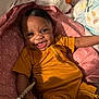 Kaliyah is registered to the contest to win money with this photo: baby, smiling, onesie, blanket, pink, heart_pattern, plush_toy, pacifier, infant, happy, lying_down, indoor, cute, child, young, person, hand, clothing, nursery, baby_care