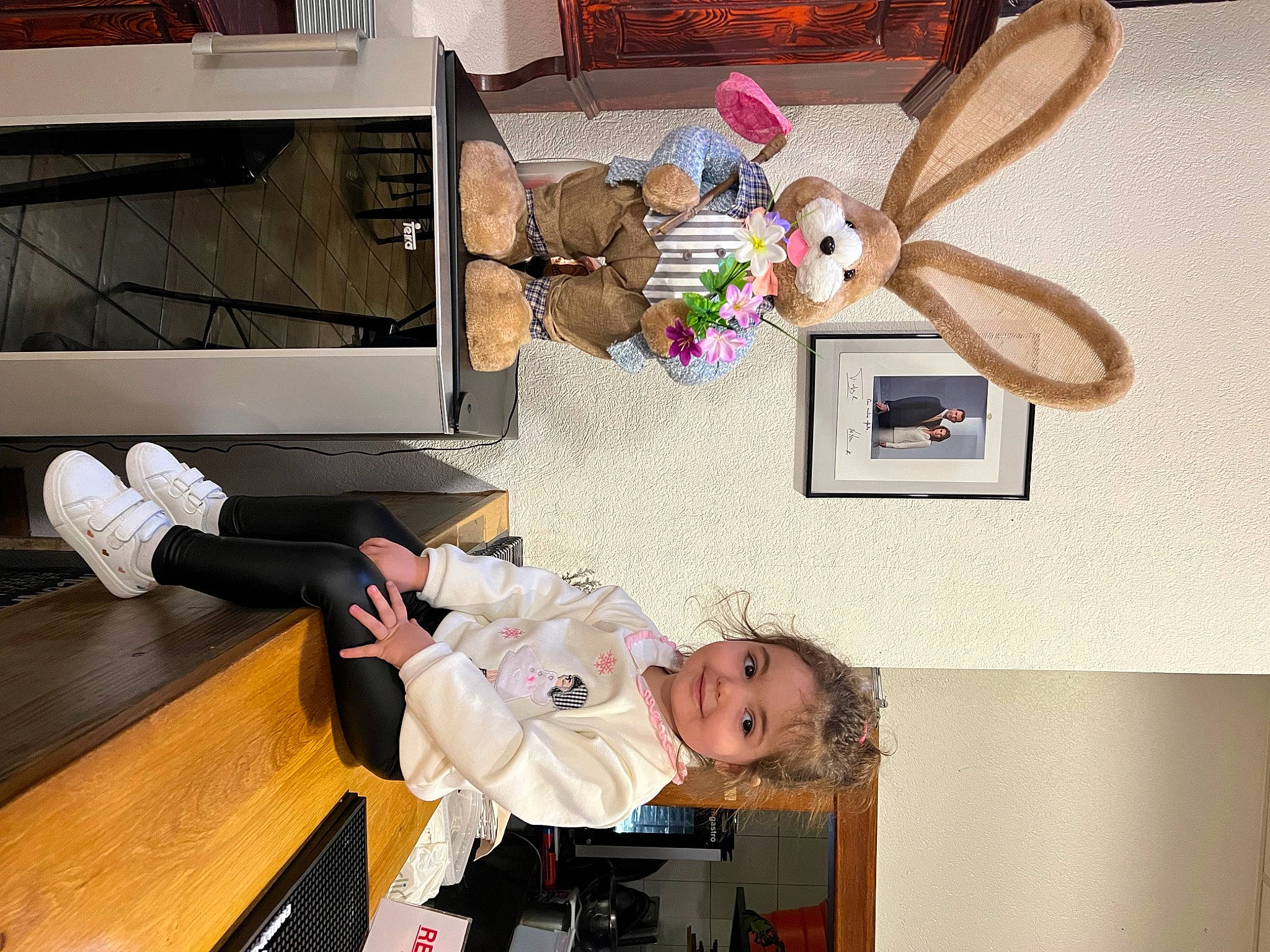 Aliah Valentina participe au concours pour gagner de l'argent avec cette photo : child, comfort, easter_bunny, fun, home_appliance, joy, mammal, party_supply, person, picture_frame, product, room, shelving, toddler, toy, visual_arts, wood