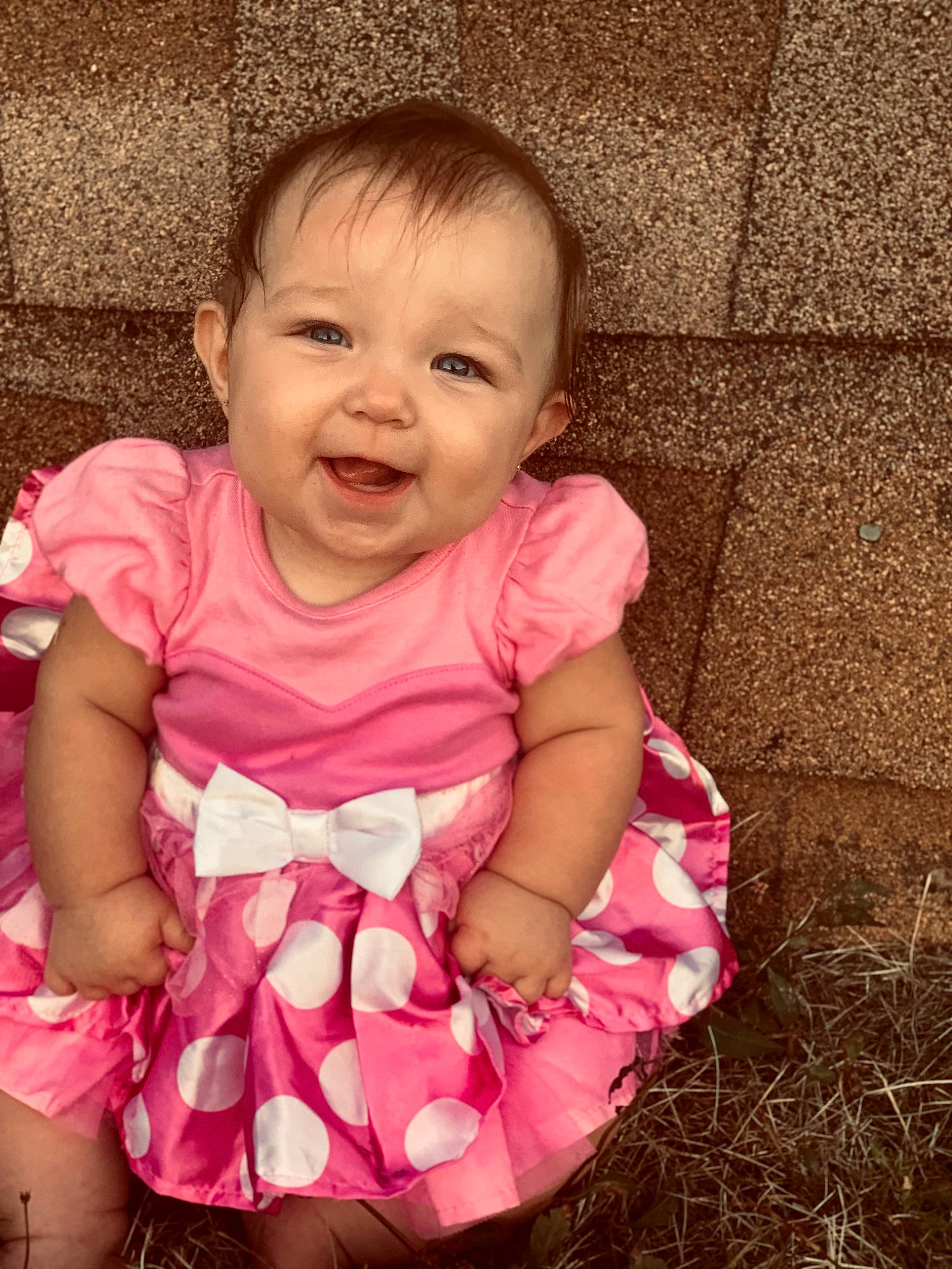 Emberley is registered to the contest to win money with this photo: baby, baby_toddler_clothing, cheek, dress, eye, face, finger, gesture, happy, head, iris, lip, mouth, nose, pattern, person, pink, skin, sleeve, smile