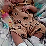 baby, blanket, bottle, clothing, cute, face, footwear, frilly_socks, heart_emoji, infant, leopard_print, lying_down, person, portrait, resting, sleepwear, soft_texture, toy, winnie_the_pooh, young_child