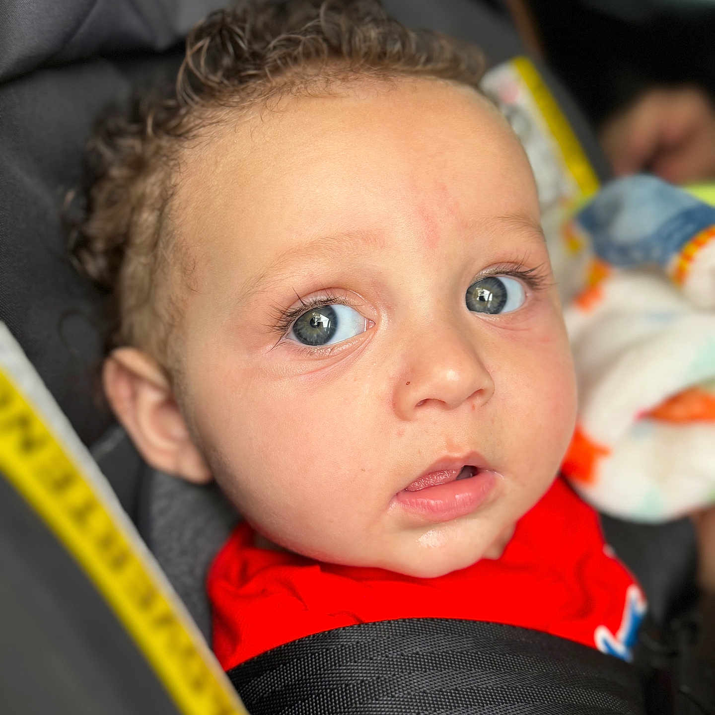 Luciano is registered to the contest to win money with this photo: accessories, baby, belt, bodypart, car, car_interior, carseat, cushion, face, finger, hand, happy, head, homedecor, newborn, person, photography, portrait, transportation, vehicle