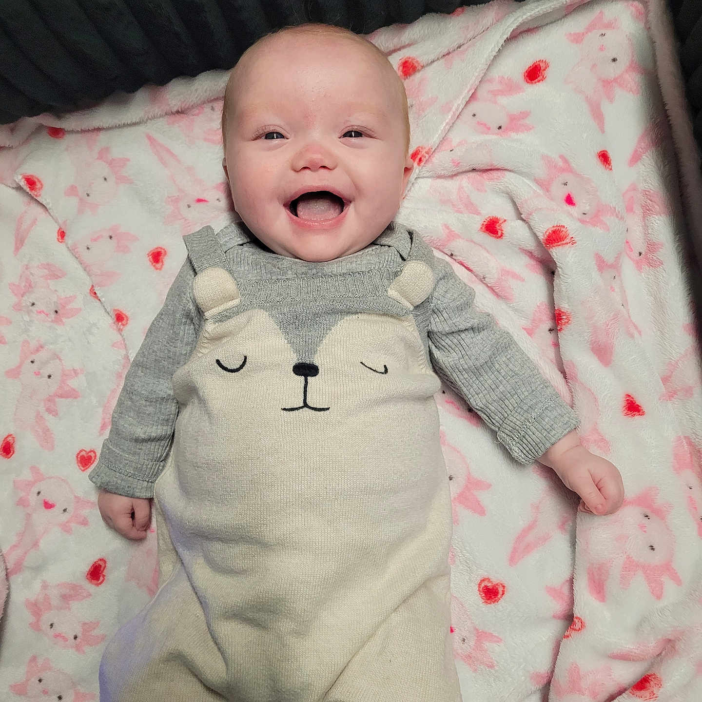 Prudence joined the competition — help win amazing prizes! baby, infant, smiling, cute, onesie, blanket, pink, animal_theme, happy, lying_down, soft_texture, cozy, child, portrait, indoors, warm, small_hands, face, head, clothing
