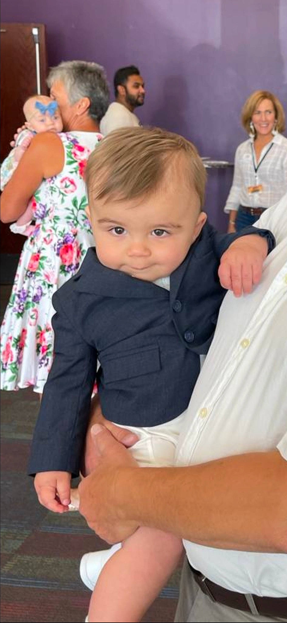 Chance is registered to the contest to win money with this photo: baby, baby_toddler_clothing, chair, child, comfort, event, finger, gesture, hair, hand, happy, head, joint, joy, lap, person, shoulder, sitting, sleeve, standing