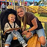 Ryker joined the competition — help win amazing prizes! child, toddler, young_woman, stroller, smiling, happy, outdoor, fairground, carnival, ferris_wheel, amusement_park, sitting, portrait, denim, sneakers, snack, wooden_table, hay_bales, blue_sky, family