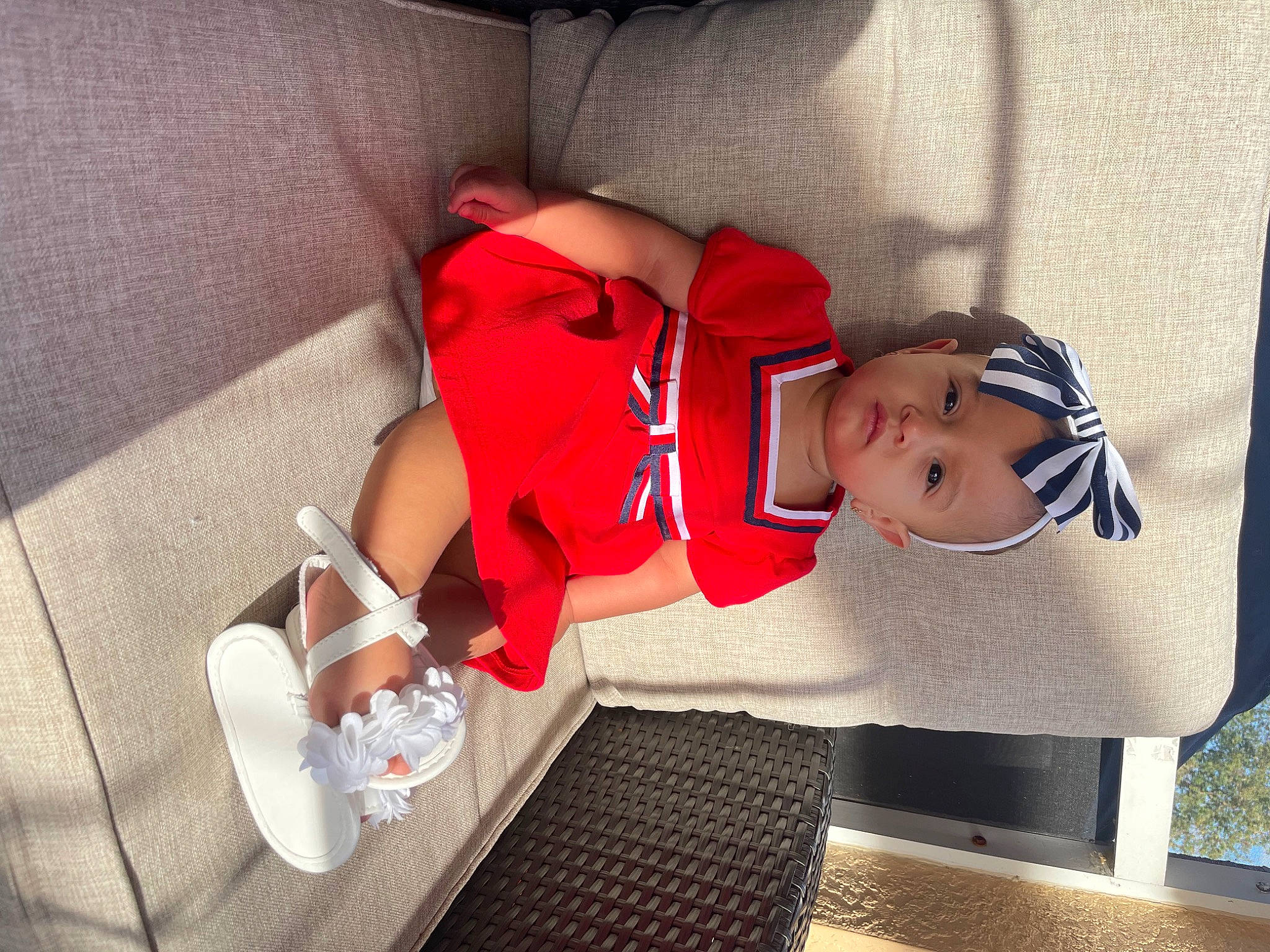 Alari is registered to the contest to win money with this photo: baby, baby_products, baby_toddler_clothing, carmine, child, comfort, elbow, goggles, hand, hat, human_body, human_leg, knee, leg, person, shorts, sitting, sock, sunglasses, thigh