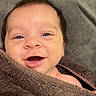 baby, blanket, child, closeup, cozy, cute, expression, face, hair, happy, head, indoors, infant, person, portrait, skin, smile, towel, wrapped, young