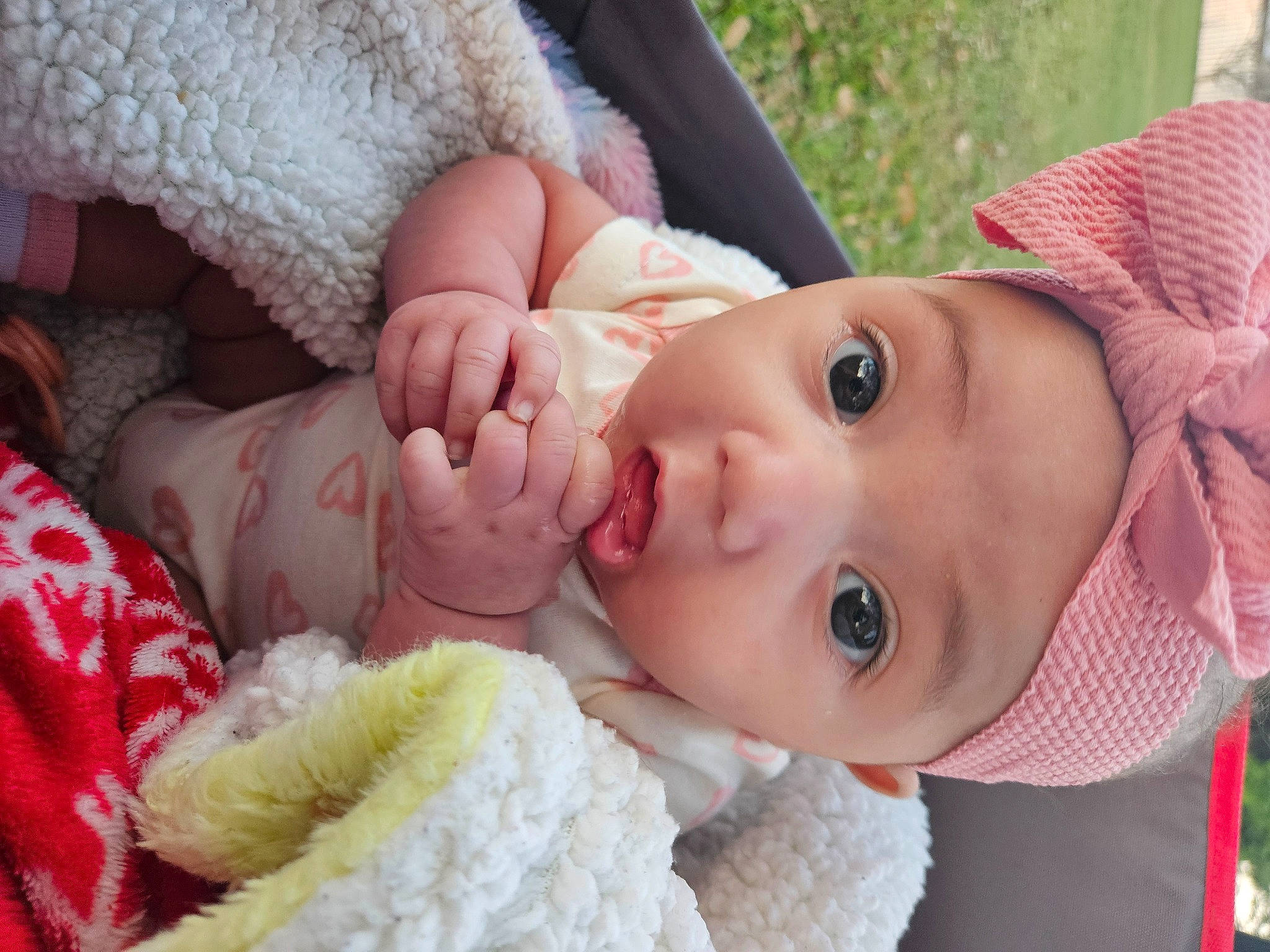 Azriel is registered to the contest to win money with this photo: baby, baby_toddler_clothing, cheek, eye, eyelash, face, finger, gesture, hand, hat, headwear, lip, mouth, nose, organ, person, pink, plant, product, skin