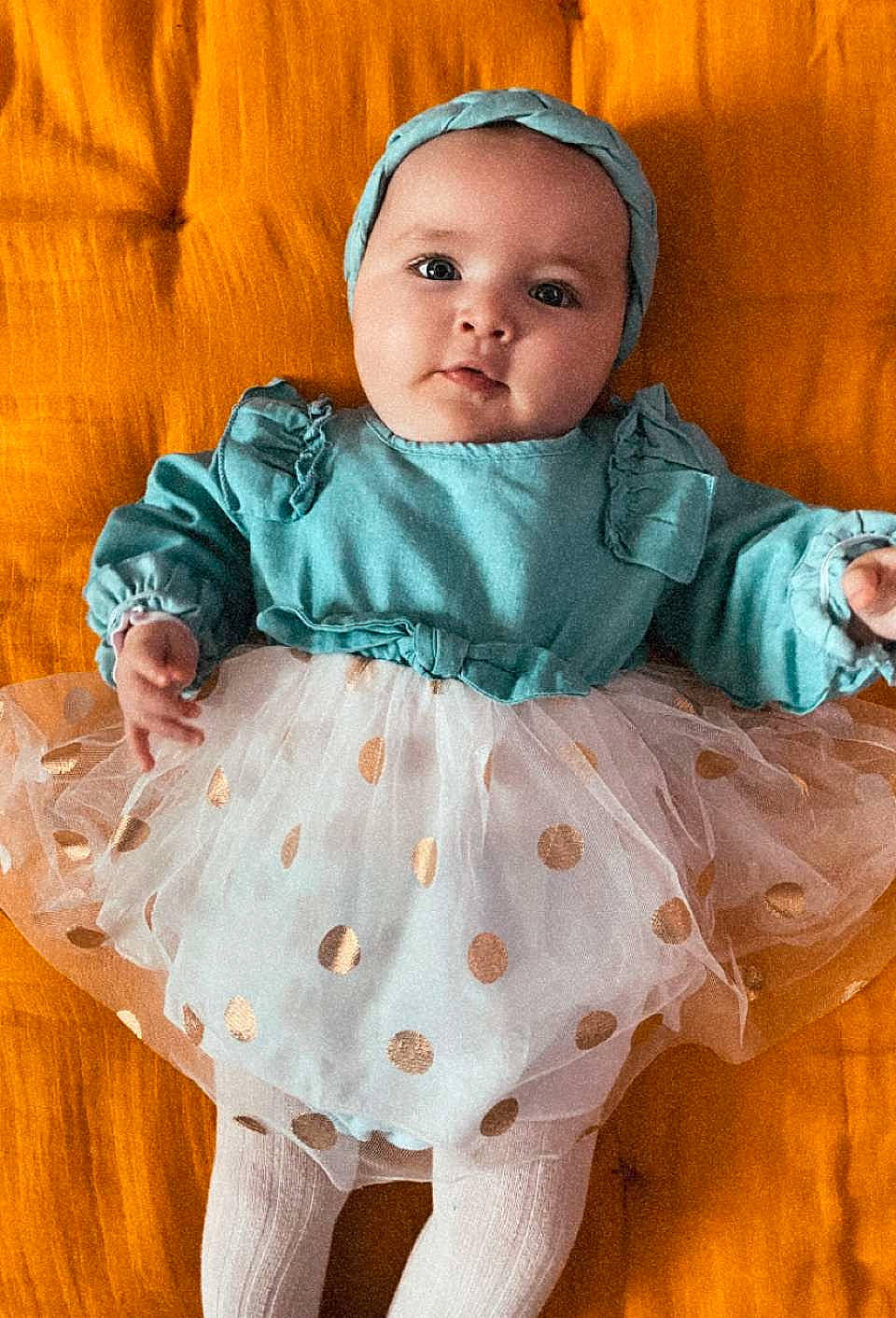 Alya participe au concours pour gagner de l'argent avec cette photo : baby, baby_products, baby_toddler_clothing, cheek, child, collar, comfort, day_dress, happy, linens, outerwear, pattern, peach, person, pink, product, sitting, skin, sleeve, textile