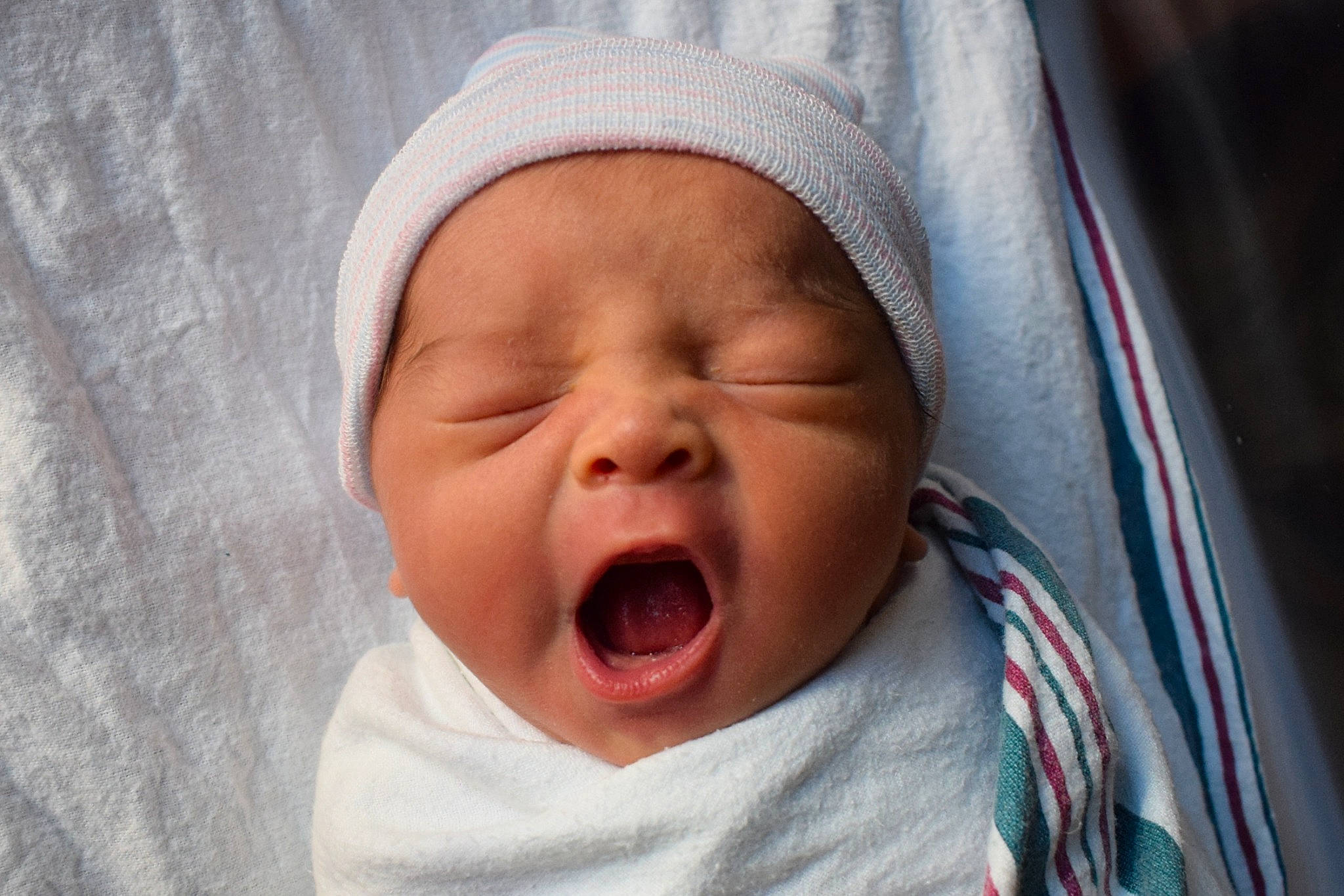 Kaiden is registered to the contest to win money with this photo: baby, baby_toddler_clothing, carmine, cheek, child, close_up, comfort, eyebrow, face, happy, headgear, headwear, laugh, linens, lip, mouth, nose, person, skin, smile