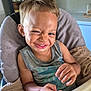 La'Kailyn joined the competition — help win amazing prizes! child, boy, smile, winking, high_chair, blanket, tank_top, indoor, face, happy, cute, furniture, person, skin, hand, expression, casual, young_child, home, flag