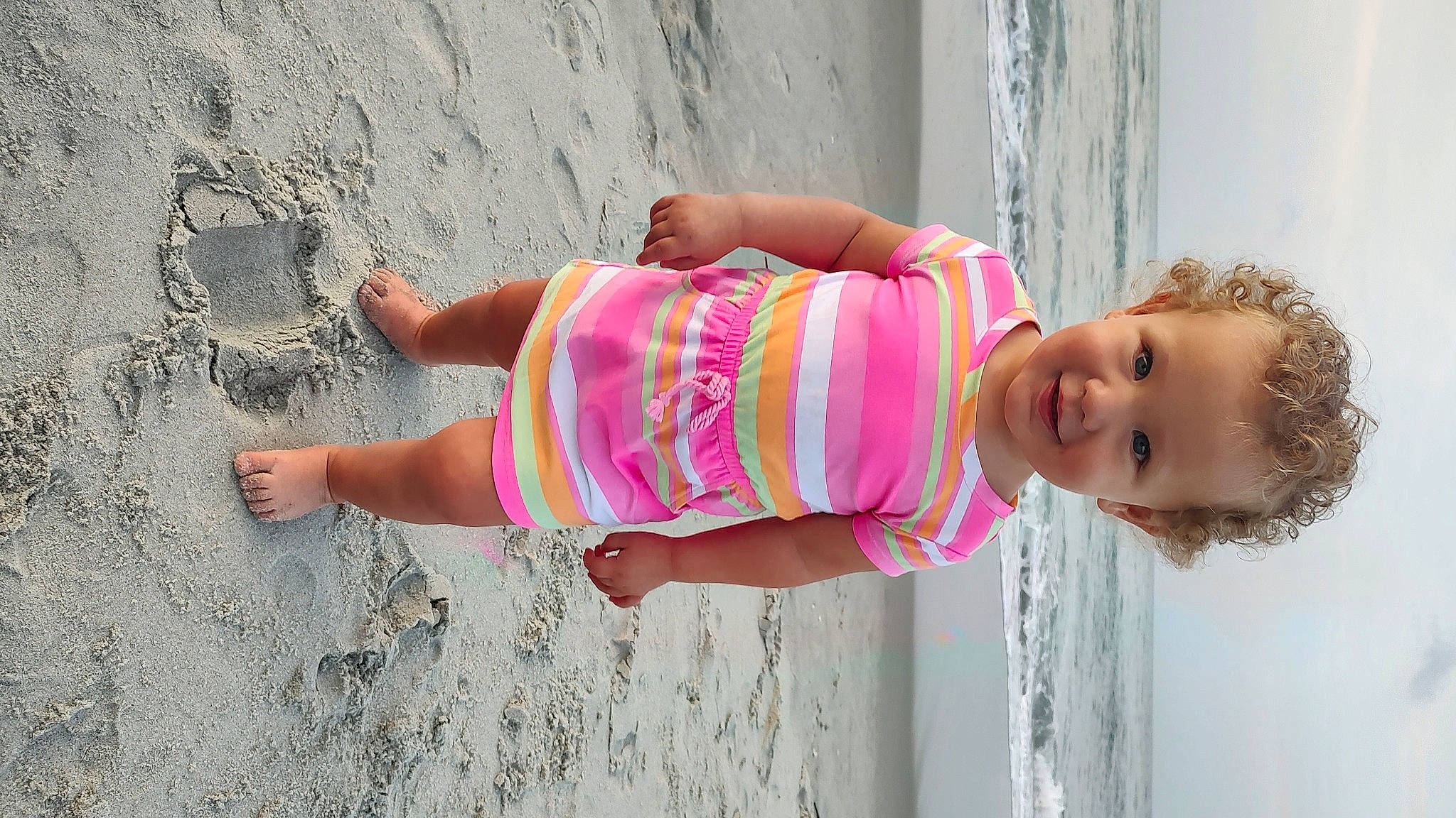 Della joined the competition — help win amazing prizes! azure, baby_toddler_clothing, beach, dress, eye, fun, happy, human_body, human_leg, joy, leg, leisure, magenta, person, pink, skin, smile, summer, thigh, toddler