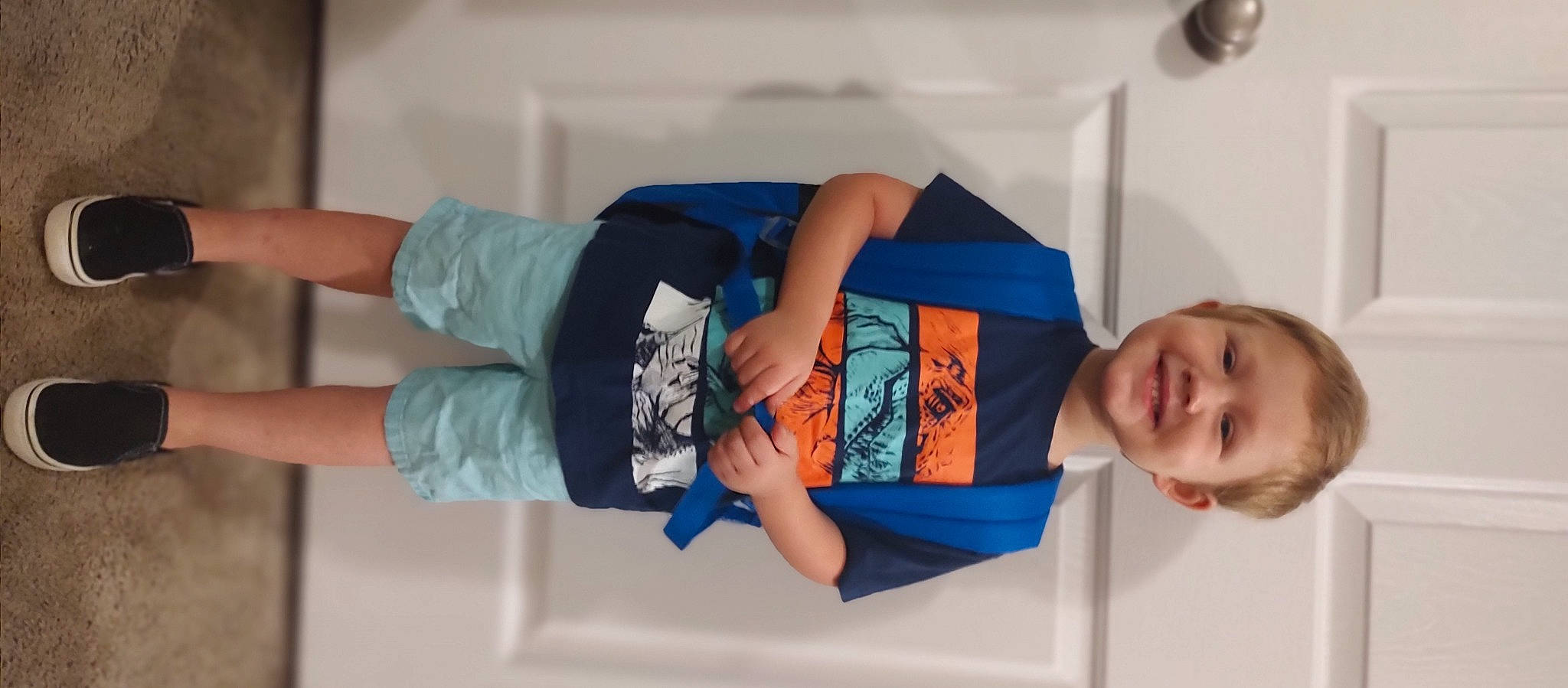 Matthew is registered to the contest to win money with this photo: arm, balance, child, comfort, denim, elbow, electric_blue, fun, human_leg, joint, joy, knee, leisure, person, room, shoulder, sleeve, smile, t_shirt, thigh