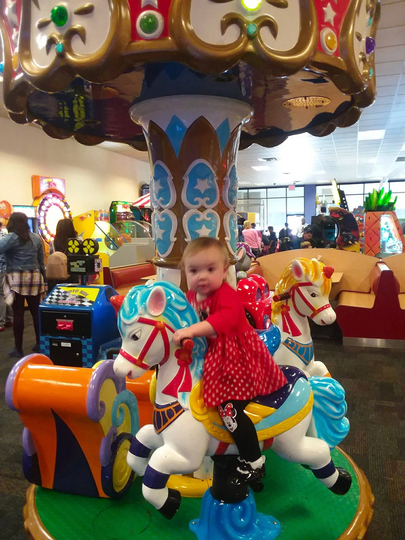 Haley is registered to the contest to win money with this photo: amusement_park, amusement_ride, blue, carousel, child, event, fair, fun, horse, leisure, lighting, outdoor_recreation, person, photograph, playground, product, recreation, riding_toy, smile, snapshot