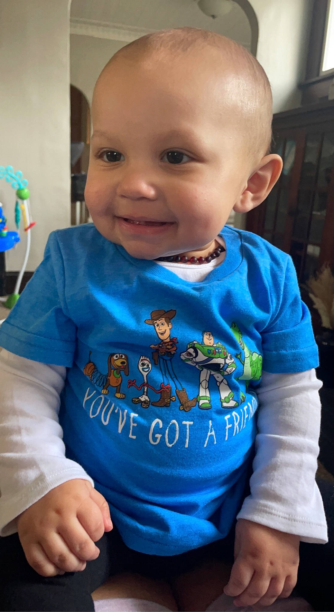 Lux is registered to the contest to win money with this photo: azure, baby_toddler_clothing, cheek, child, chin, facial_expression, hairstyle, happy, human, iris, joy, mammal, nose, person, plant, product, skin, sleeve, smile, standing