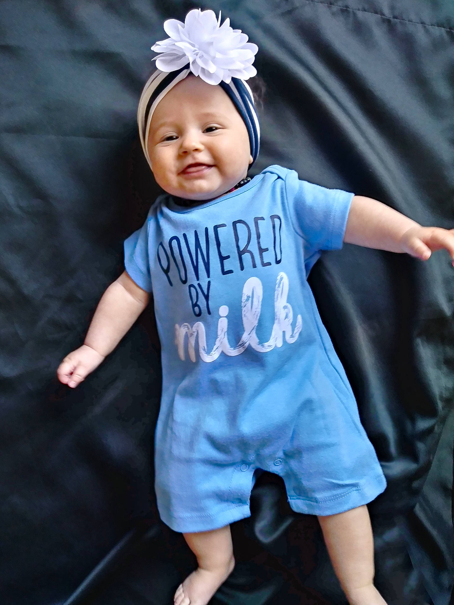Edie joined the competition — help win amazing prizes! arm, baby, baby_products, baby_toddler_clothing, blue, child, child_model, clothing, costume, denim, hair_accessory, headband, headgear, headpiece, person, product, sleeve, t_shirt, textile, toddler