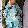 Rónán joined the competition — help win amazing prizes! baby, newborn, sleeping, pacifier, onesie, disney_pixar, blue_clothing, blanket, knitted, crib, infant, cute, peaceful, child, portrait, resting, indoors, soft_light, clothing, bed