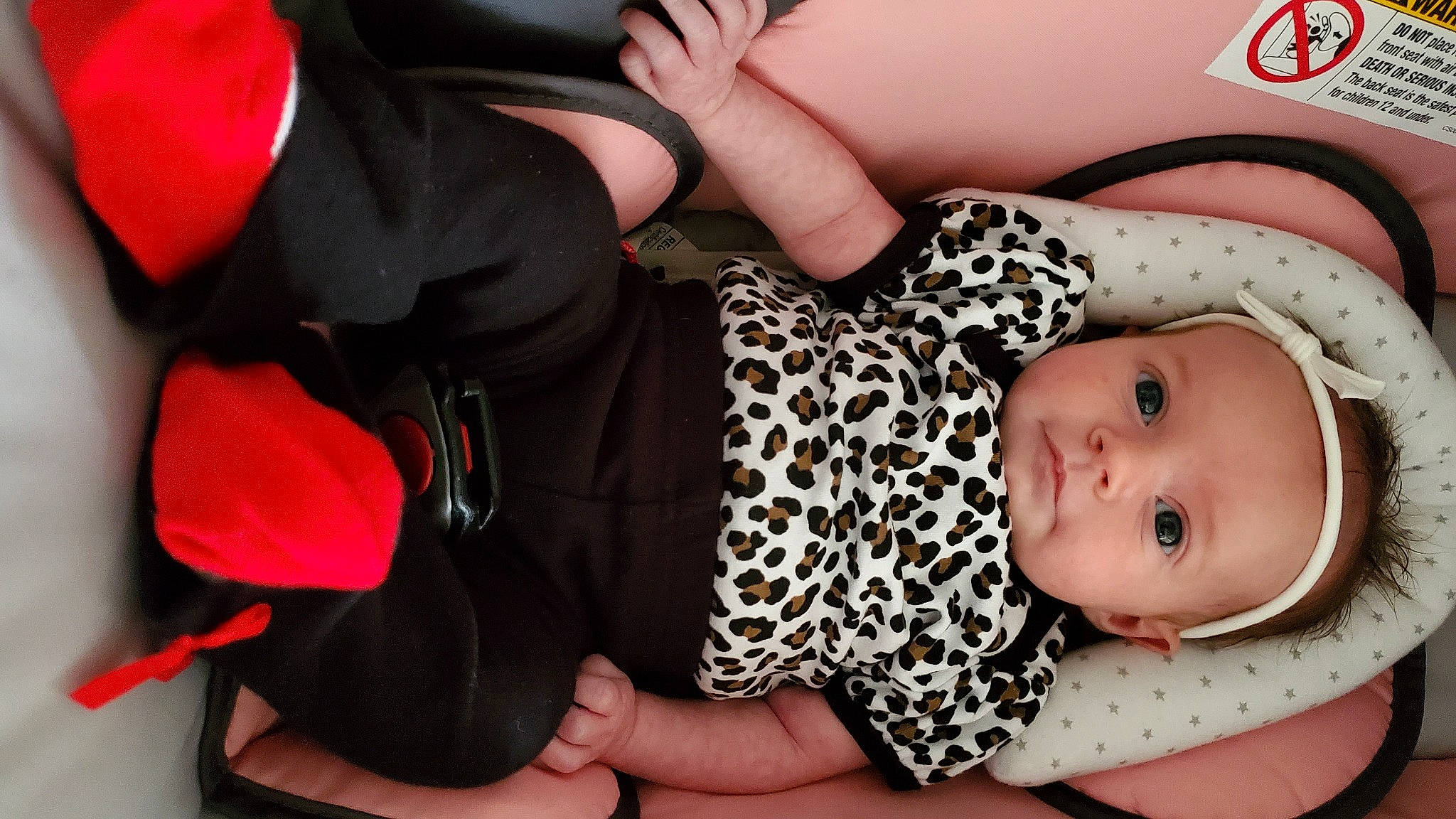 Minnow is registered to the contest to win money with this photo: baby, baby_products, baby_toddler_clothing, child, comfort, fashion_accessory, finger, gesture, hand, headwear, human_body, human_leg, mouth, nail, pattern, person, pink, sleeve, textile, thigh