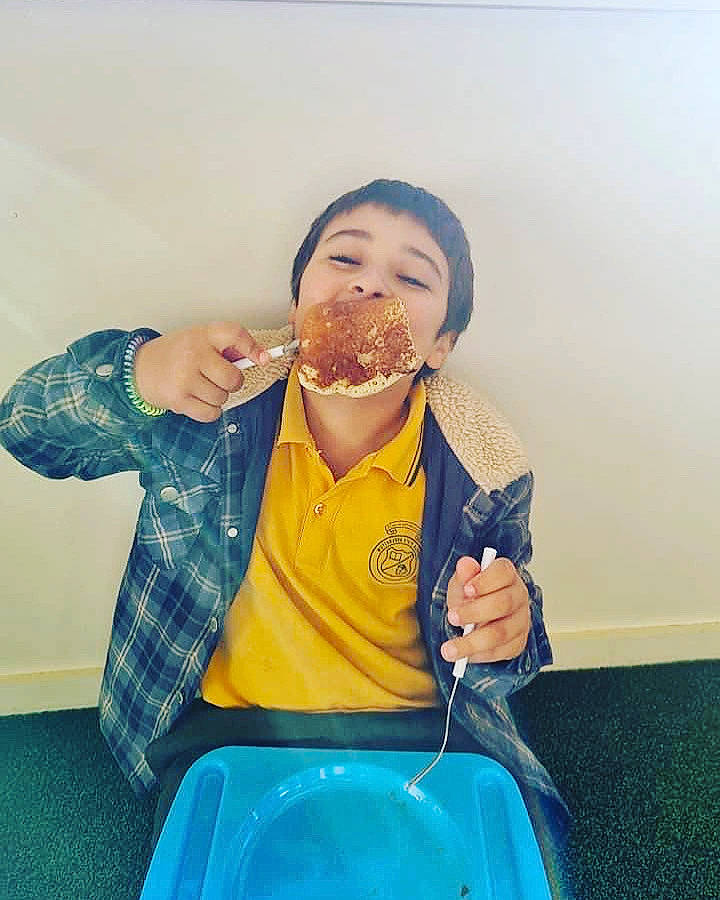 Arthur is registered to the contest to win money with this photo: breakfast, child, cuisine, dish, drink, drinking, eating, electric_blue, finger, food, food_craving, fruit, fun, gesture, happy, junk_food, person, sitting, sweetness, tableware