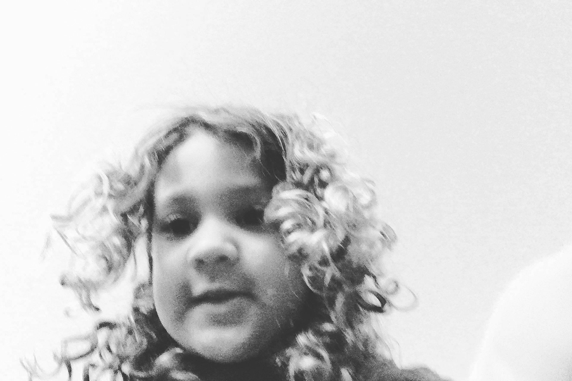 Isabella is registered to the contest to win money with this photo: black_hair, child, cloud, eyebrow, eyelash, flash_photography, gesture, hand, happy, human_body, iris, lip, long_hair, monochrome, monochrome_photography, nose, person, plant, sky, smile