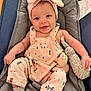 Guinevere joined the competition — help win amazing prizes! baby, infant, smile, headband, overalls, plush_toy, cushion, socks, cute, happy, child, indoors, person, soft_toy, fabric, face, comfort, seated, apparel, playful