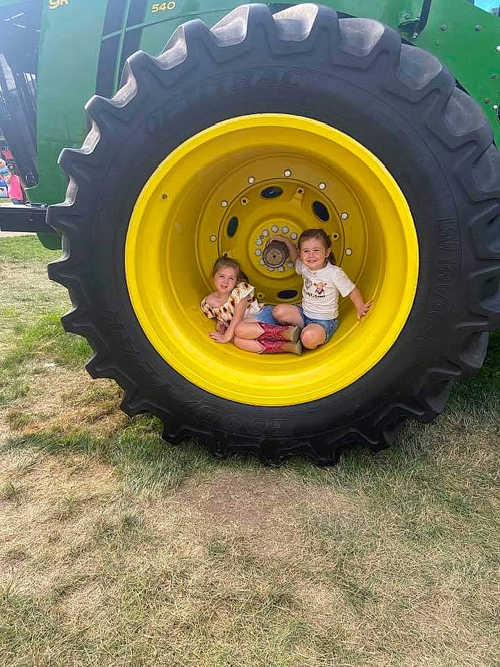 Adaline is registered to the contest to win money with this photo: auto_part, automotive_design, automotive_exterior, automotive_tire, automotive_wheel_system, fender, grass, hubcap, joy, locking_hubs, motor_vehicle, person, plant, rim, rolling, synthetic_rubber, tire, tire_care, tractor, tread