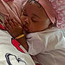 Deyana joined the competition — help win amazing prizes! baby, bracelet, close_up, cuddling, cute, hand, heart_pattern, indoors, infant, nap, pacifier, peaceful, person, pink_bonnet, resting, skin, sleeping, soft_lighting, toddler, white_shirt