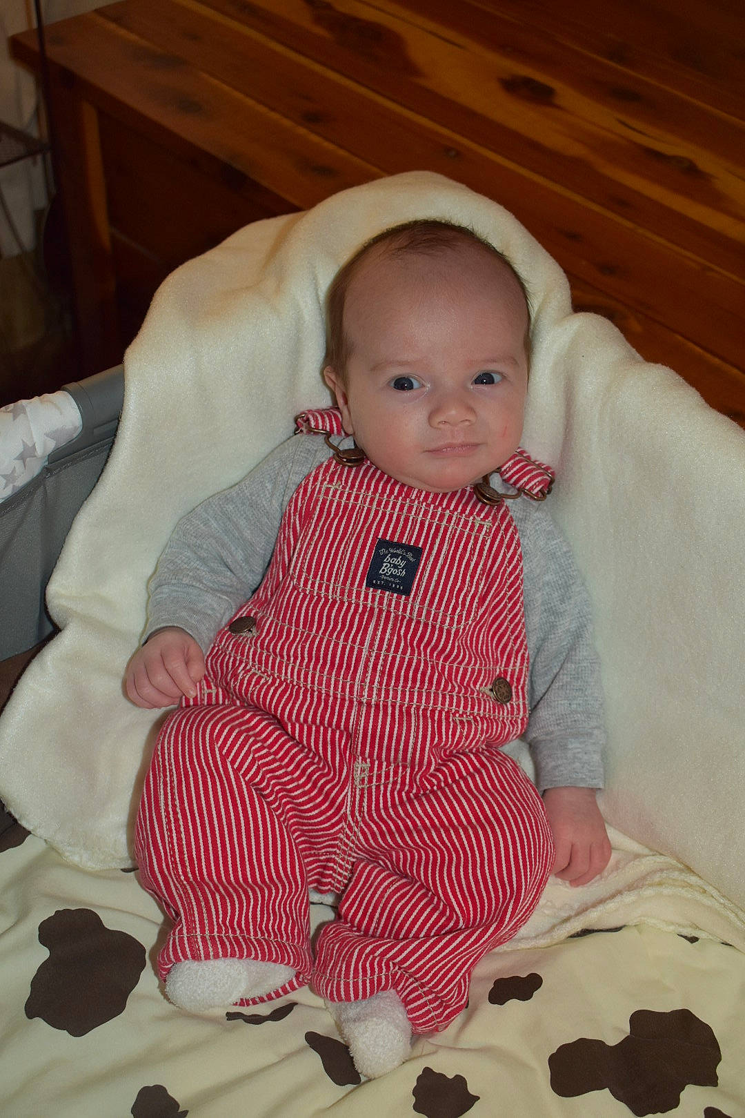 Brantlee is registered to the contest to win money with this photo: baby, baby_toddler_clothing, cheek, child, comfort, dress, face, floor, flooring, human_body, jacket, mammal, outerwear, person, pink, skin, sleeve, smile, textile, toddler