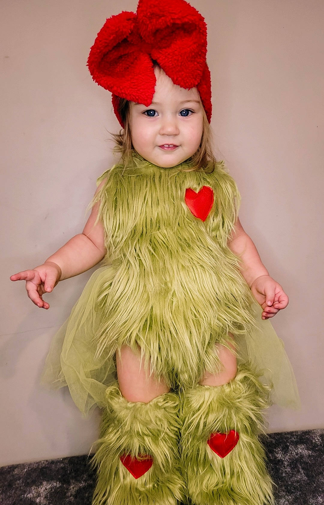 Emmalynn joined the competition — help win amazing prizes! baby_toddler_clothing, cap, child, christmas_tree, costume_hat, embellishment, face, fashion_accessory, fashion_design, fur, hairstyle, hat, head, headgear, headwear, joy, long_hair, magenta, person, pink