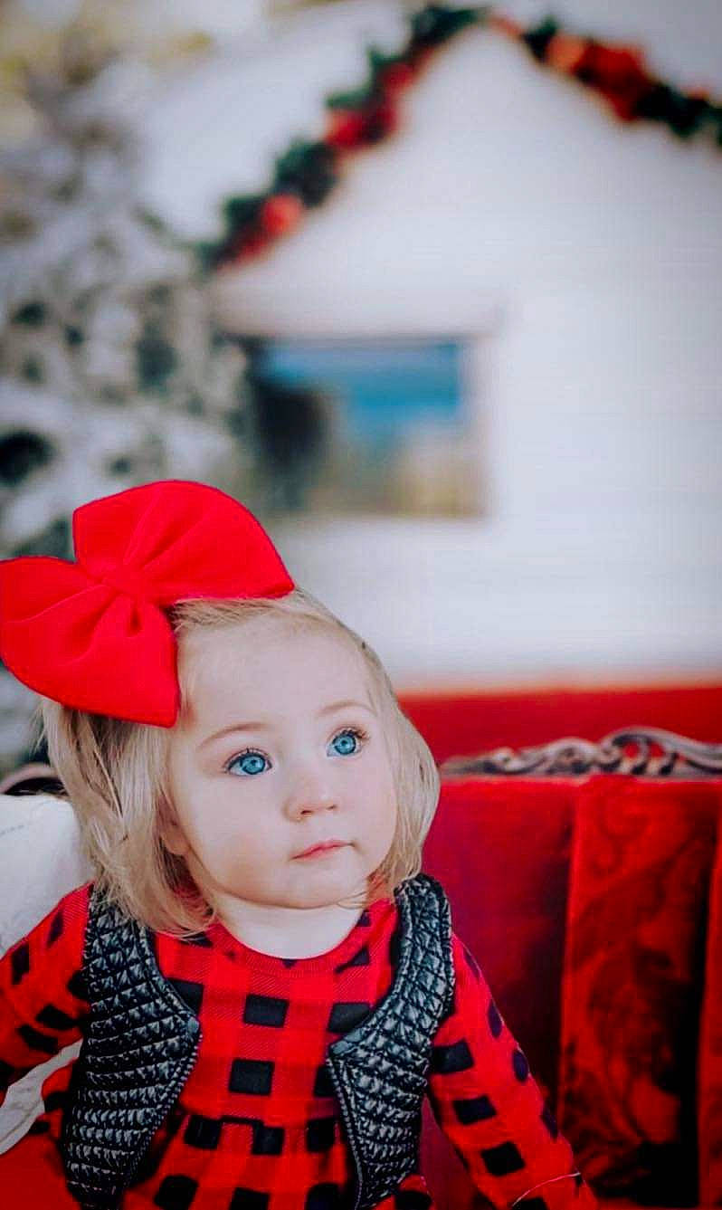 Emmalynn joined the competition — help win amazing prizes! carmine, child, costume_hat, event, eye, fashion_accessory, fur, hair, happy, hat, lip, magenta, pattern, person, photograph, red, sleeve, toddler, tradition, white
