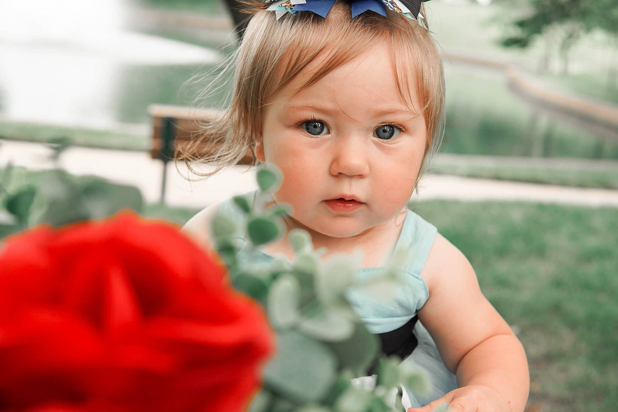 Emmalynn joined the competition — help win amazing prizes! baby, baby_toddler_clothing, blue, dress, eye, eyelash, eyewear, face, facial_expression, goggles, grass, happy, people_in_nature, person, petal, plant, rose, sunglasses, toddler, vision_care